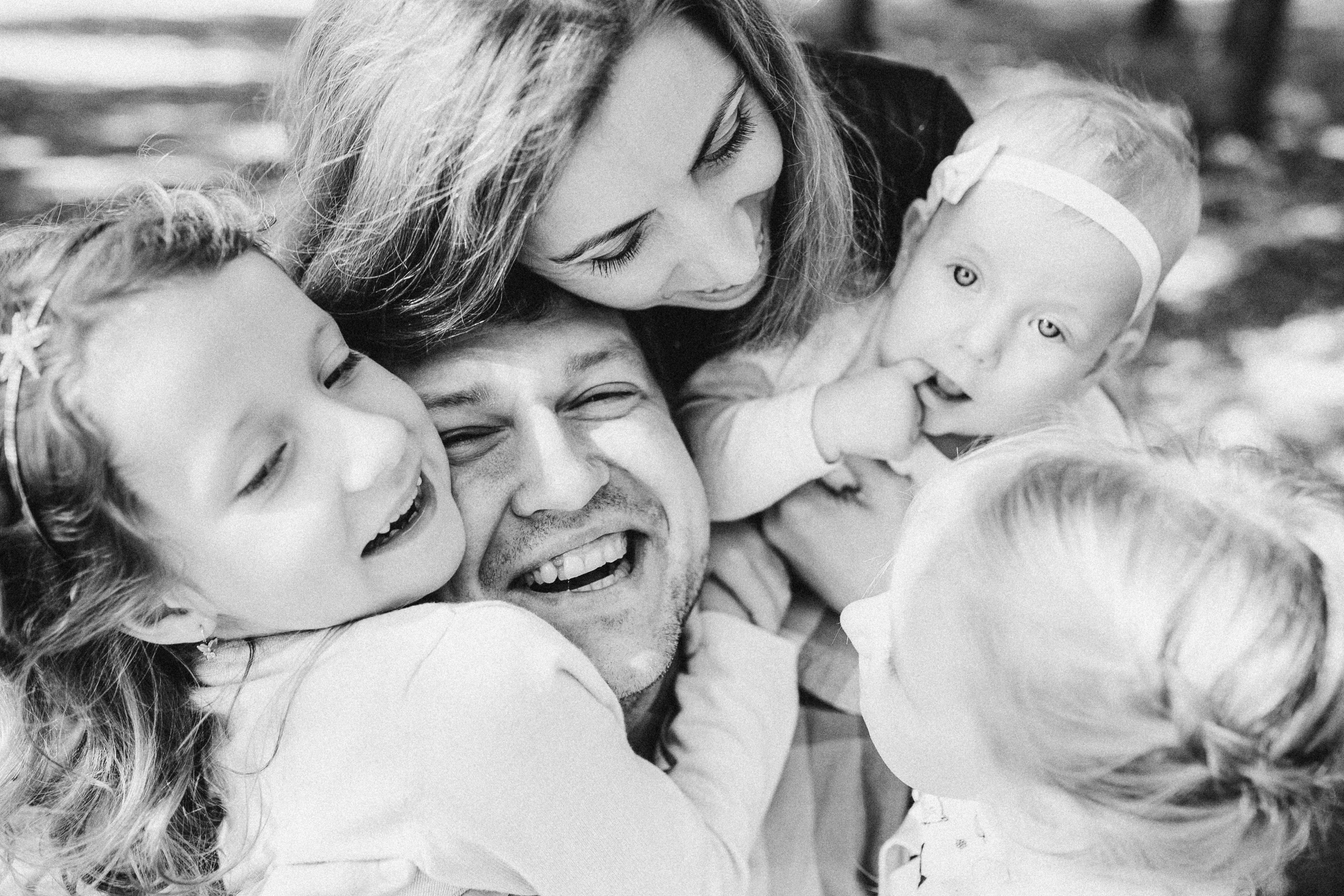 a black and white photo of a family, a black and white photo, by Emma Andijewska, pexels, smiling down from above, michal mraz, facebook post, 15081959 21121991 01012000 4k