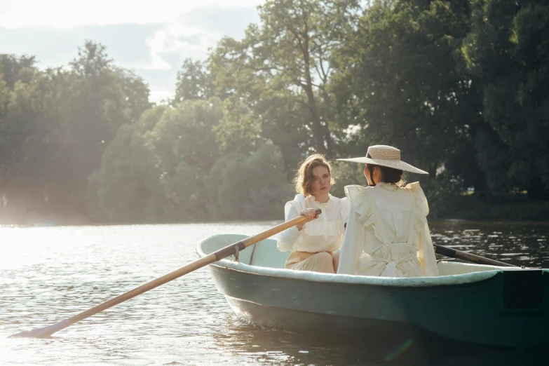 two people in a row boat on a lake, inspired by Enrique Simonet, unsplash, slim aarons, eva green and gemma arterton, cottagecore, white