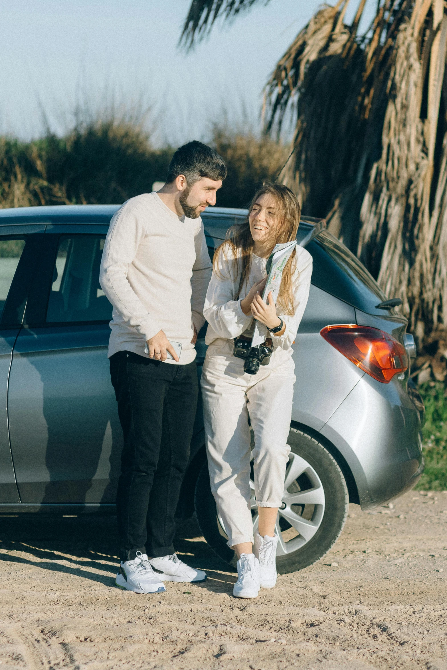 a man and a woman standing next to a car, pexels contest winner, flirting, wide full body, official screenshot, caucasian