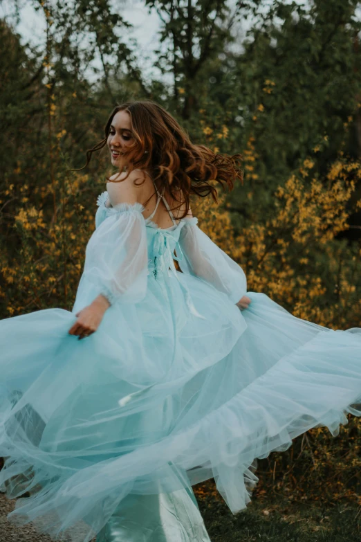 a woman in a blue dress standing in a field, an album cover, by Alexis Simon Belle, pexels contest winner, renaissance, twirls, flowy hair, 15081959 21121991 01012000 4k, romantic gown