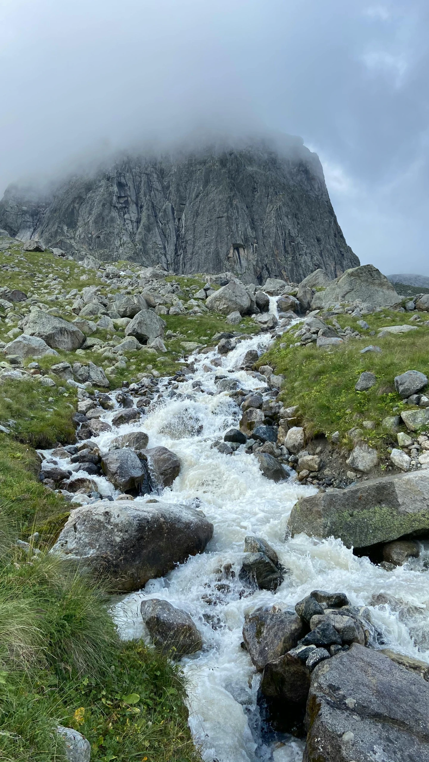 a stream running through a lush green hillside, an album cover, by Muggur, pexels contest winner, les nabis, icy mountains, low quality photo, panorama, spire