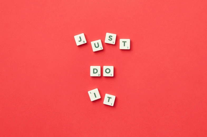 wooden blocks spelling just do it on a red background, inspired by Josef Dande, trending on unsplash, flat lay, mint, 🤬 🤮 💕 🎀, taken in the early 2020s