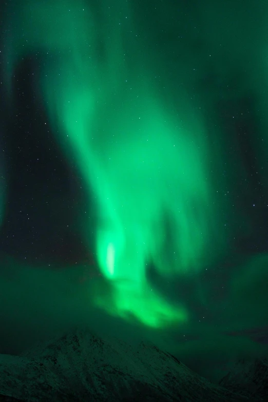 the northern lights in the sky above a mountain range, by Terese Nielsen, pexels contest winner, dynamic closeup, dark green, glowing from inside, lapland