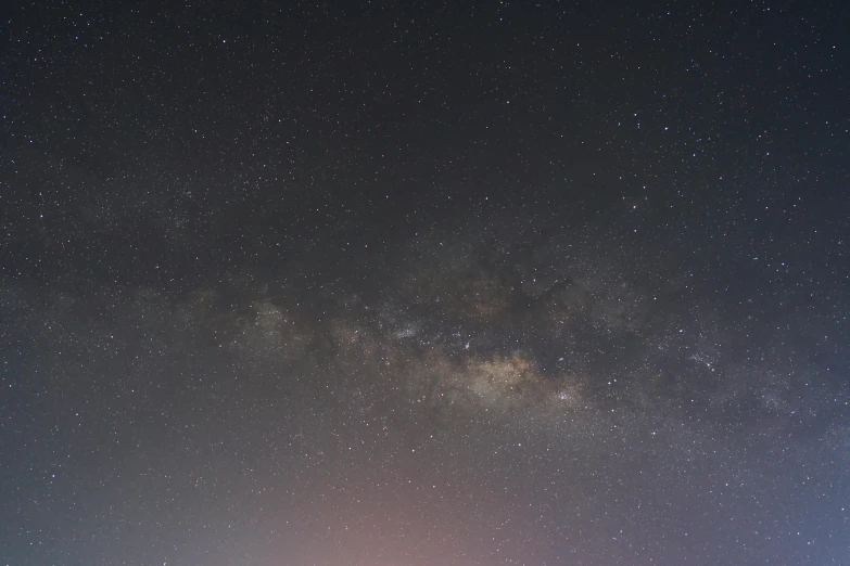 the milky shines brightly in the night sky, by Attila Meszlenyi, pexels, dreamy hazy, starry sky 8 k, brown, cinematic footage