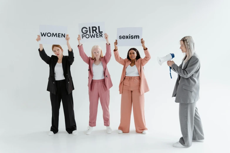 a group of women standing next to each other holding signs, trending on pexels, feminist art, background image, white background, girl standing, powerfull