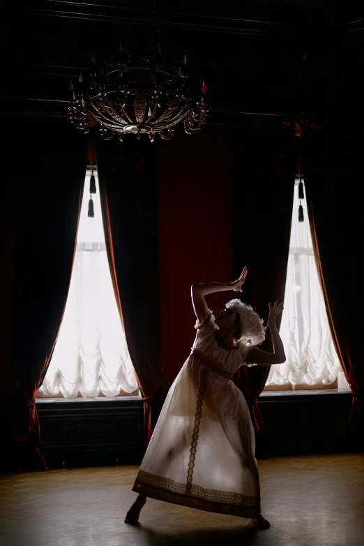 a woman in a white dress dancing in a dark room, inspired by Cecil Beaton, unsplash, arabesque, victorian room, slide show, window lighting, ( ( theatrical ) )