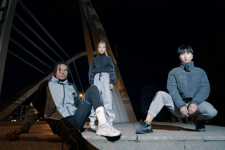 three people sitting on the edge of a bridge at night, inspired by Gang Hui-an, unsplash, realism, wearing space techwear, avatar image, uniform off - white sky, promotional image