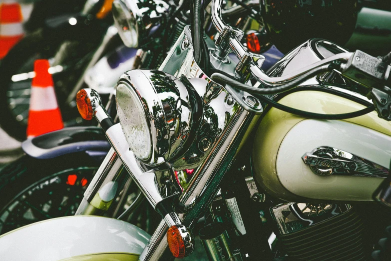 a row of motorcycles parked next to each other, by Gavin Nolan, unsplash, photorealism, white mechanical details, colourful close up shot, 🚿🗝📝