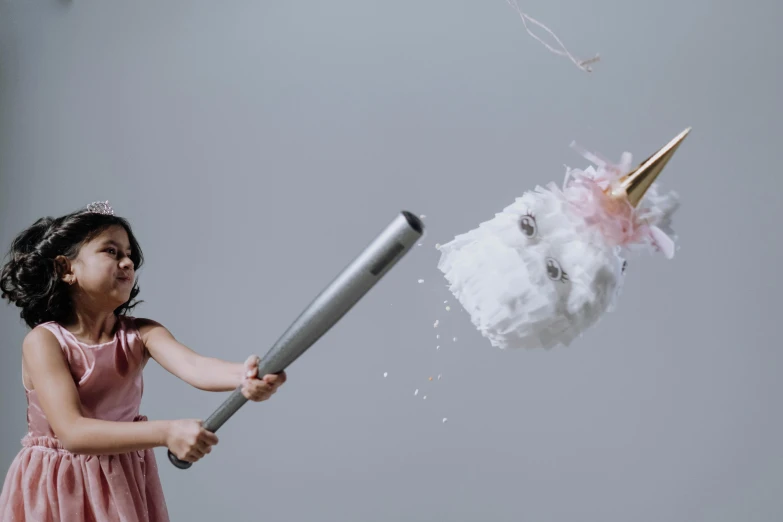 a little girl in a pink dress holding a baseball bat, inspired by Frieke Janssens, pexels contest winner, conceptual art, big explosion, dry ice, holding a giant flail, on a gray background