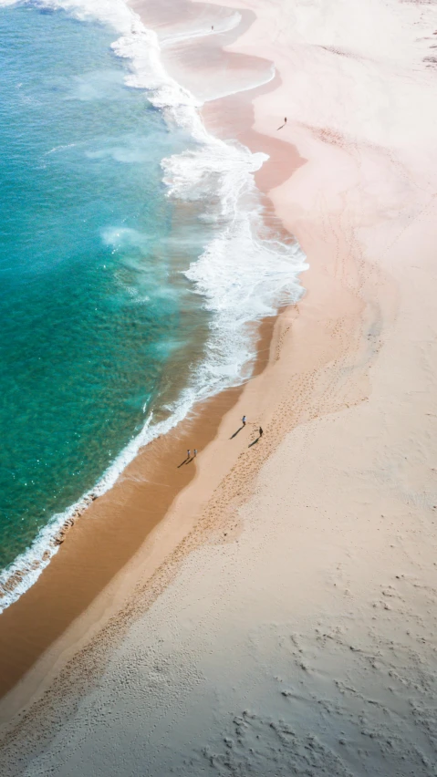 a large body of water next to a sandy beach, by Jesper Knudsen, pexels contest winner, birds eye, 15081959 21121991 01012000 4k, conde nast traveler photo, subtle colors