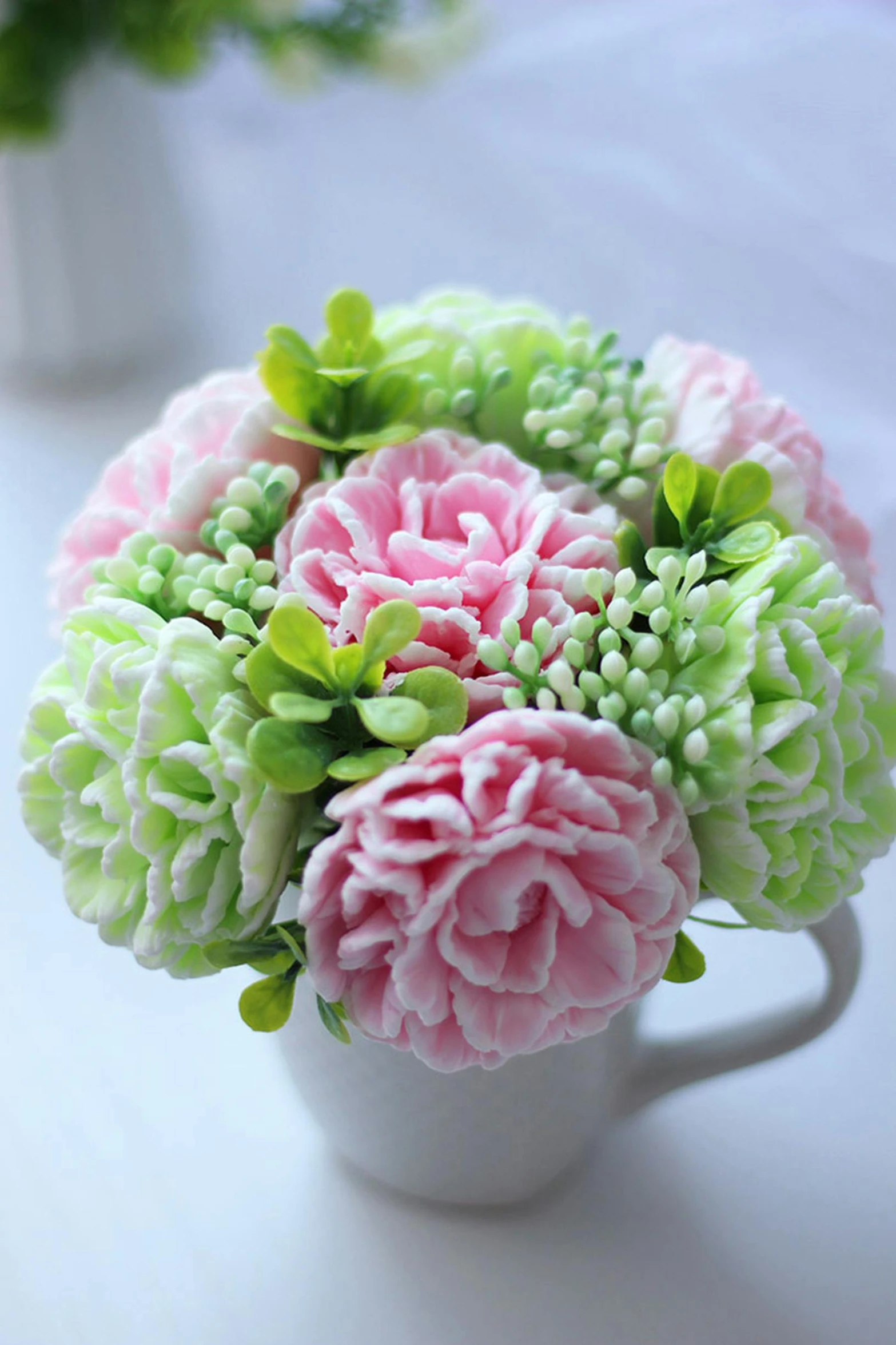 a white cup filled with pink and green flowers, sculpted out of candy, chrysanthemum, full product shot, cozy