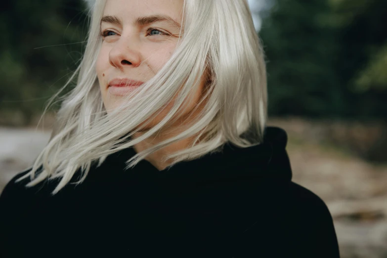 a woman with white hair and a black hoodie, inspired by Louisa Matthíasdóttir, pexels contest winner, natural skin, avatar image, well-gelled hair, emily rajtkowski