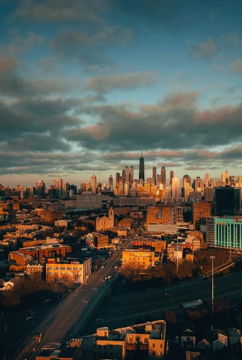 a view of a city from the top of a building, by Jacob Burck, pexels contest winner, chicago skyline, late afternoon, high quality photo, ultrawide cinematic