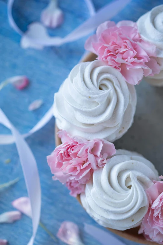 a cake with white frosting and pink flowers, unsplash, romanticism, whirlpool, detail shot, circle, photo for magazine