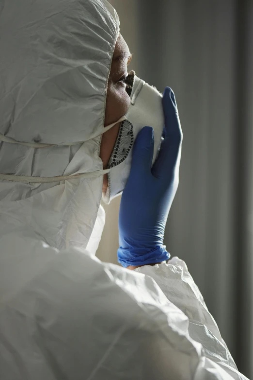 a man in a protective suit talking on a cell phone, profile image, paul barson, surgical supplies, trending photo