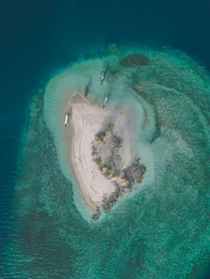 a heart shaped island in the middle of the ocean, by Robbie Trevino, pexels contest winner, hurufiyya, philippines, in the middle of a small colony, tan, frontal shot