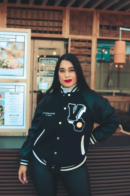 a woman standing in front of a restaurant, black bomber jacket, v tuber, wearing rr diner uniform, alanis guillen