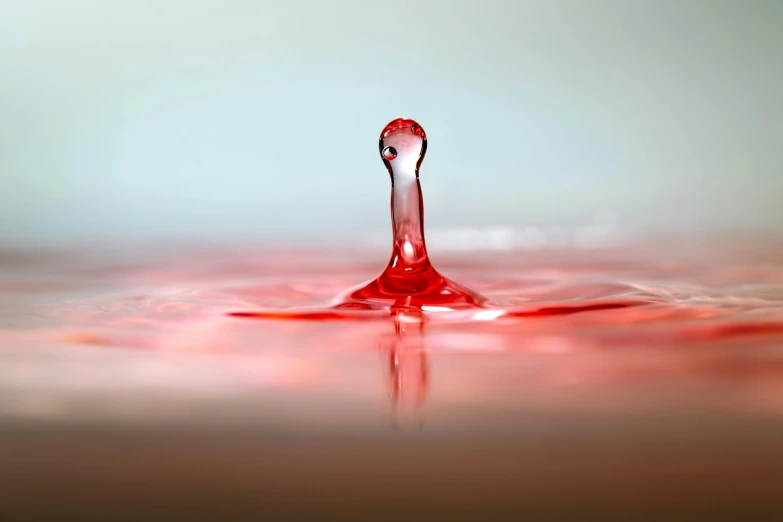 a drop of water sitting on top of a table, inspired by Lucio Fontana, shutterstock contest winner, pools of blood, 15081959 21121991 01012000 4k, needles, profile pic