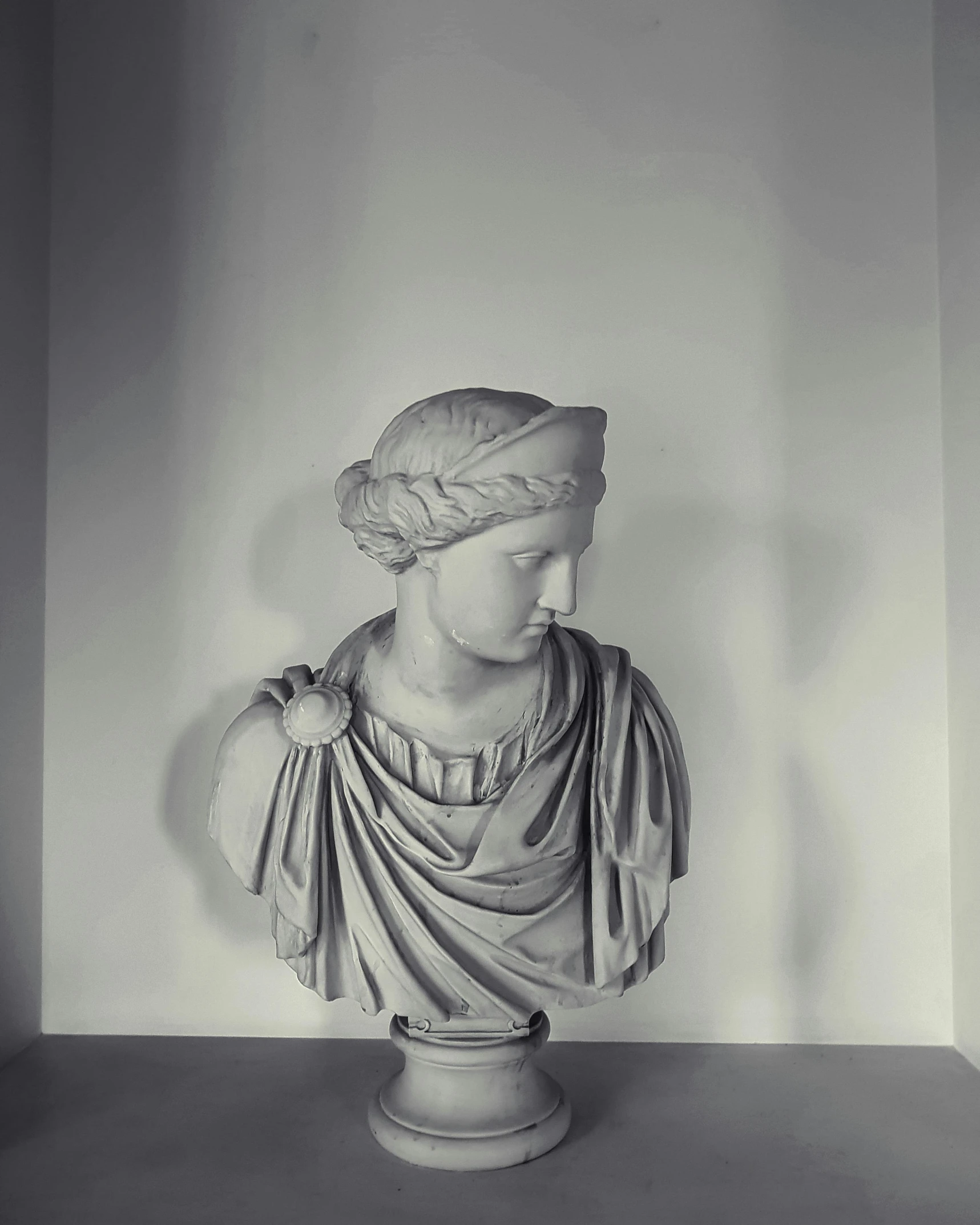 a black and white photo of a bust of a woman, inspired by Antonio Canova, pexels contest winner, laurel wreath on his head, at a museum, instagram photo, taken in the late 2010s