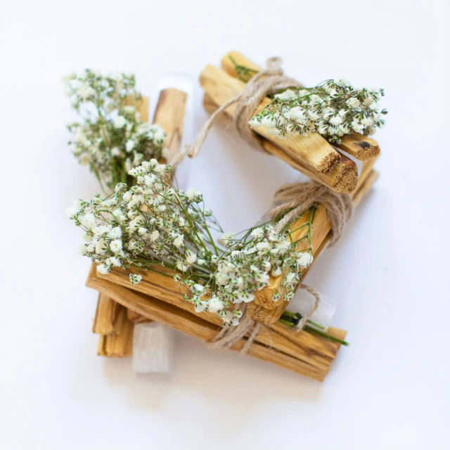 a wreath made out of sticks and baby's breath, a picture, trending on pexels, romanticism, cinnamon, snacks, 中 元 节, white and orange breastplate