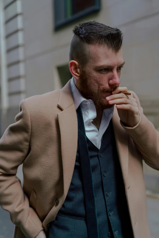 a man in a suit smoking a cigarette, inspired by Mark A. Brennan, conor mcgregor, wearing jacket, ignant, hr ginger