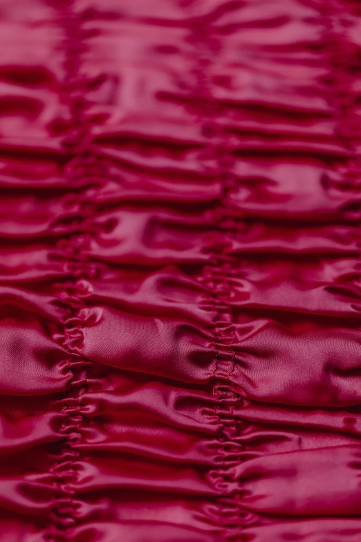 a close up of a red table cloth, by Nina Hamnett, instagram, romanticism, ruched bodice, raspberry, synthetic materials, detailed product image