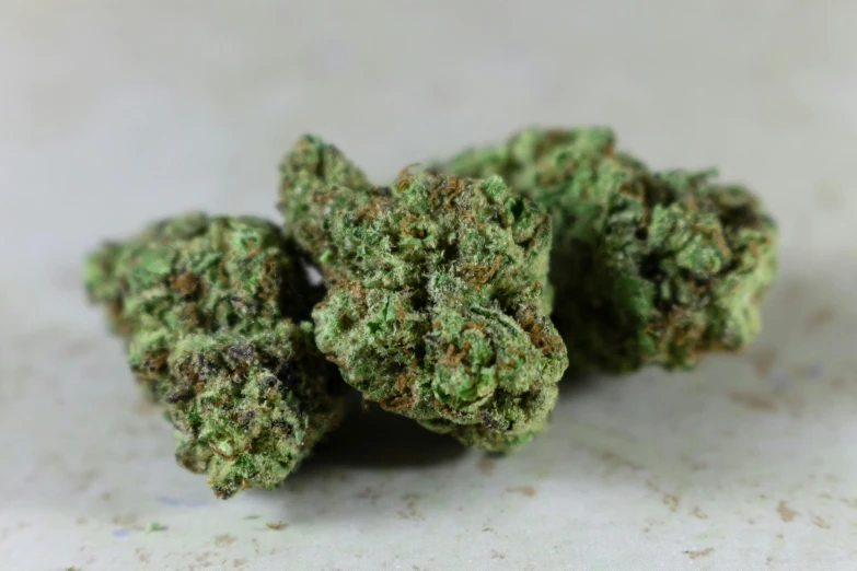 a pile of marijuana buds sitting on top of a counter, detailed product image, lush greens, portrait n - 9, detail shot