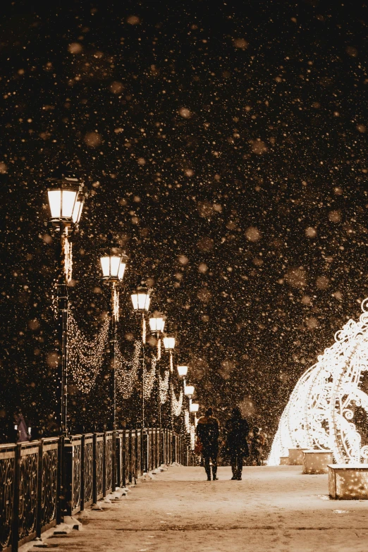 a person walking on a bridge in the snow, pexels contest winner, intricate lights, moscow, snowflakes falling, white sweeping arches