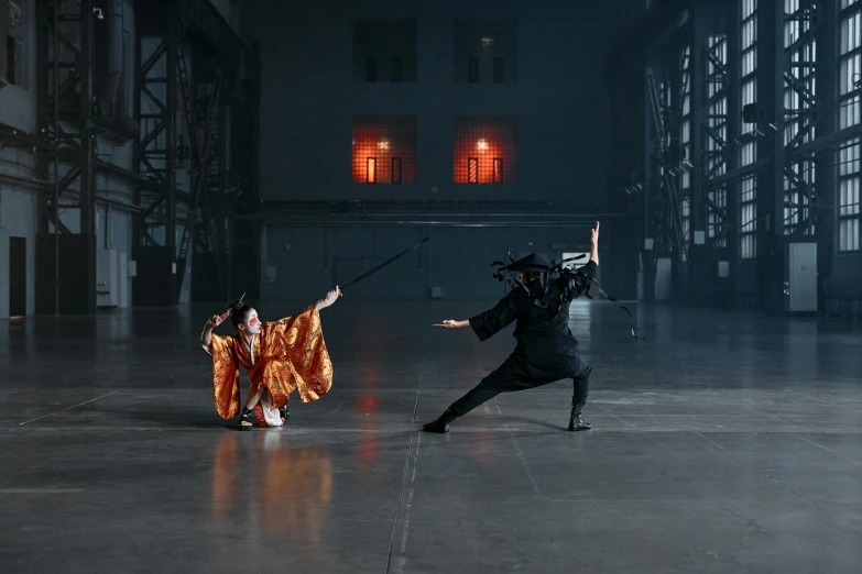 a couple of people standing on top of a cement floor, inspired by Fei Danxu, pexels contest winner, video art, dramatic wielding katana pose, facing off in a duel, palace dance, in a warehouse