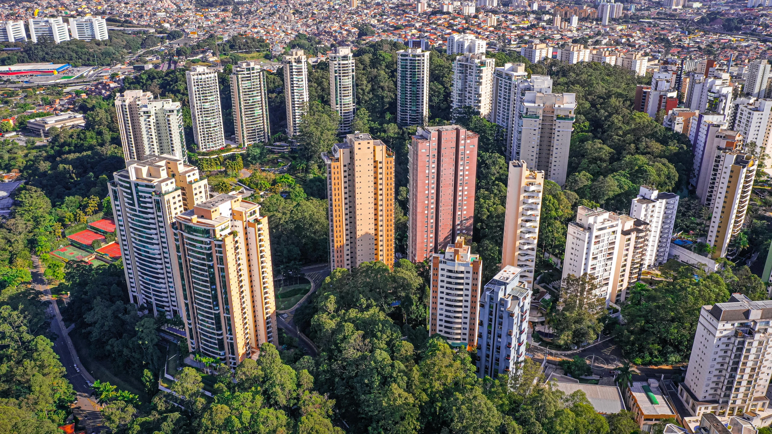 an aerial view of a city with tall buildings, by Luis Miranda, city park, city of the jungle, taken in 2022, icaro carvalho