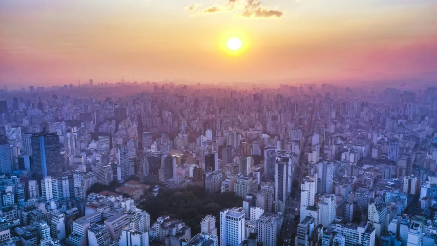 an aerial view of a city at sunset, by Luis Miranda, postapo, edu souza, multiple stories, tourist photo