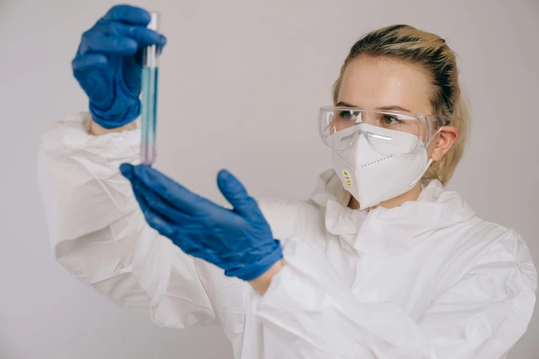 a woman in a lab coat holding a test tube, pexels contest winner, hazmat suits, avatar image, white elbow gloves, 90s photo