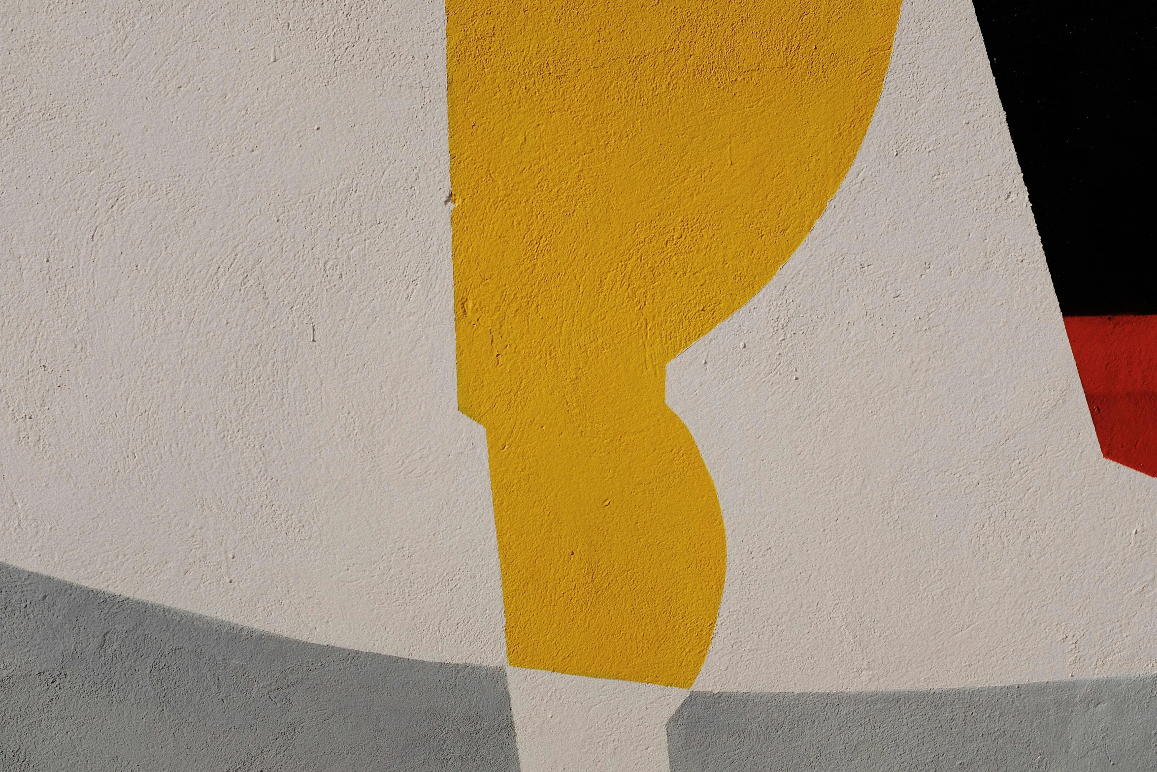 an abstract painting on the side of a building, by Leon Polk Smith, pexels contest winner, concrete art, mono-yellow, 4 k detail, curved, painting of an undercover cup