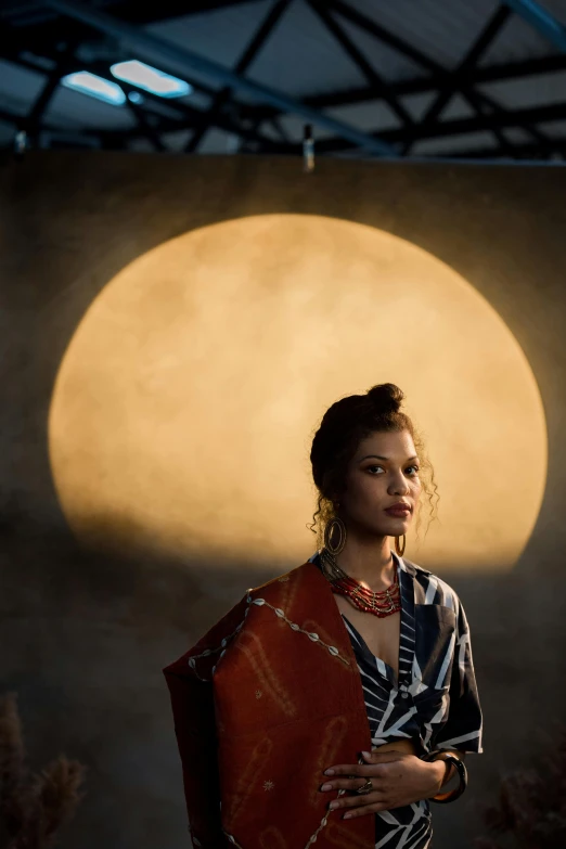 a woman standing in front of a full moon, inspired by Juan Luna, unsplash, light and space, sci-fi tibetan fashion, studio lighting”, asian sun, “zendaya