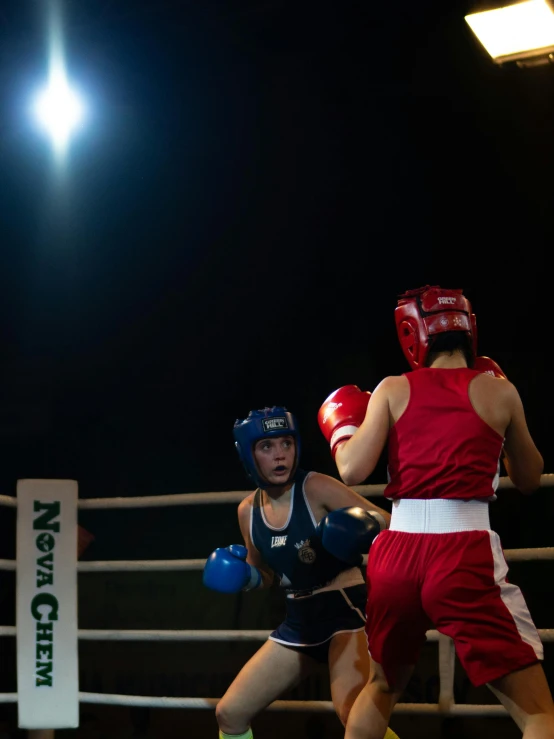 a couple of men standing next to each other in a boxing ring, by Alice Mason, pexels contest winner, happening, lighting her with a rim light, helmet view, girls, 15081959 21121991 01012000 4k