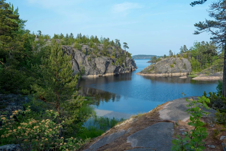 a large body of water surrounded by trees, a picture, by Eero Järnefelt, pexels contest winner, hurufiyya, rock quarry location, archipelago, thumbnail, vacation photo