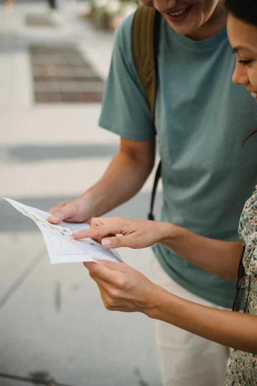 a man and a woman looking at a piece of paper, open street maps, shaded, how-to, service ticket close up