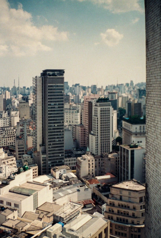 a view of a city from a tall building, inspired by Thomas Struth, trending on unsplash, brutalism, brazilian, 1960s color photograph, 1999 photograph, panoramic