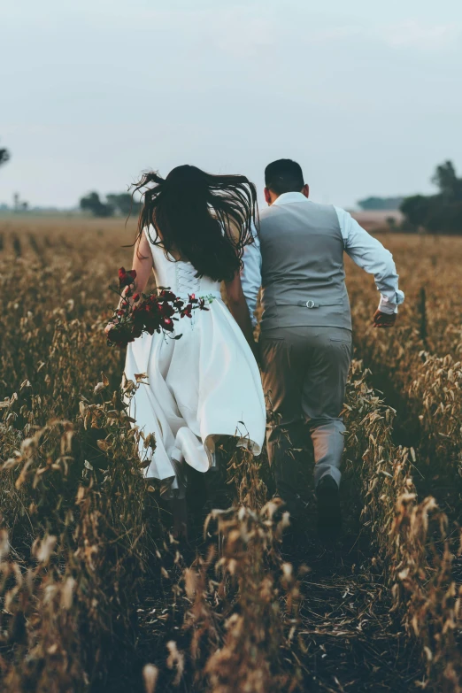 a man and a woman walking through a field, pexels contest winner, celebrating an illegal marriage, snapchat photo, harvest, running