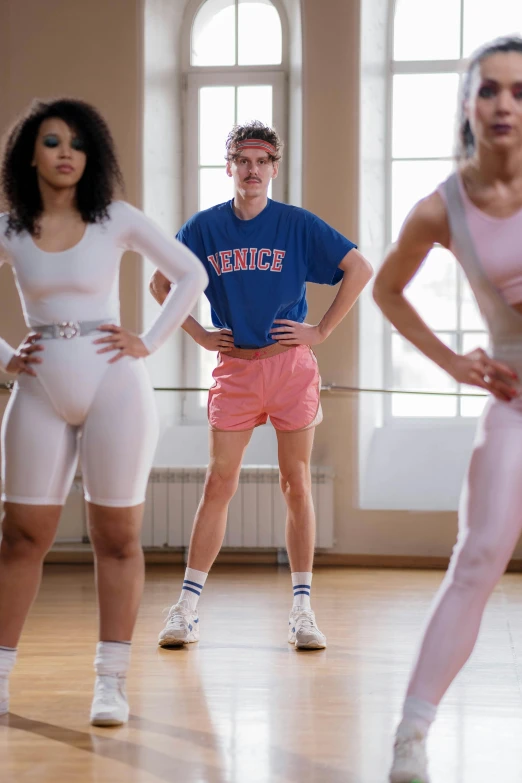 a group of women standing on top of a hard wood floor, inspired by Louis Hersent, trending on tumblr, 8 0 s sport clothing, genderless, a person standing in front of a, wearing leotard