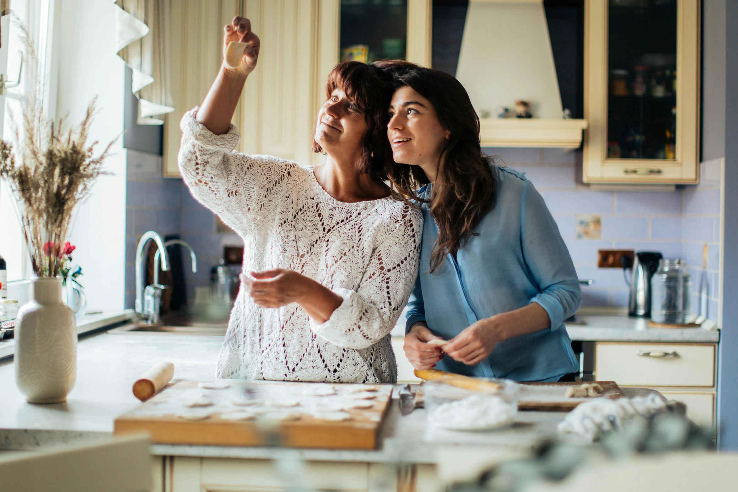 a couple of women standing next to each other in a kitchen, a picture, pexels contest winner, fan favorite, having fun, inspect in inventory image, domestic