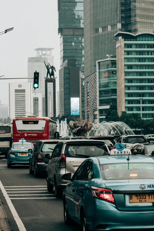 a busy city street filled with lots of traffic, pexels contest winner, jakarta, hydrogen fuel cell vehicle, square, grey