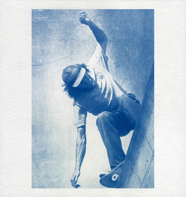 a man riding a skateboard up the side of a ramp, an album cover, by Ottó Baditz, dada, blue - print, stippled, cyanotype, full page periodical image