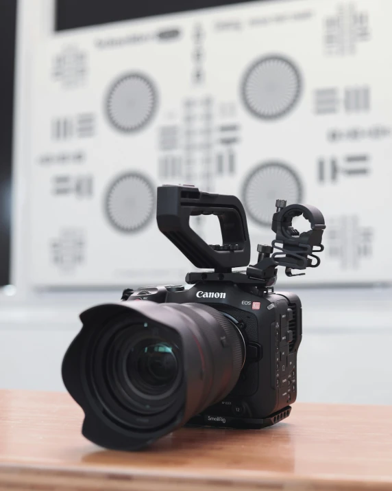 a camera sitting on top of a wooden table, by Adam Rex, unsplash contest winner, video art, canon r 5, photographed from behind, science monthly photography, studio photo