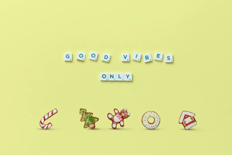 a yellow background with the words good vibes only, trending on pexels, minimalism, christmas, made out of sweets, set of high quality hd sprites, on a pale background