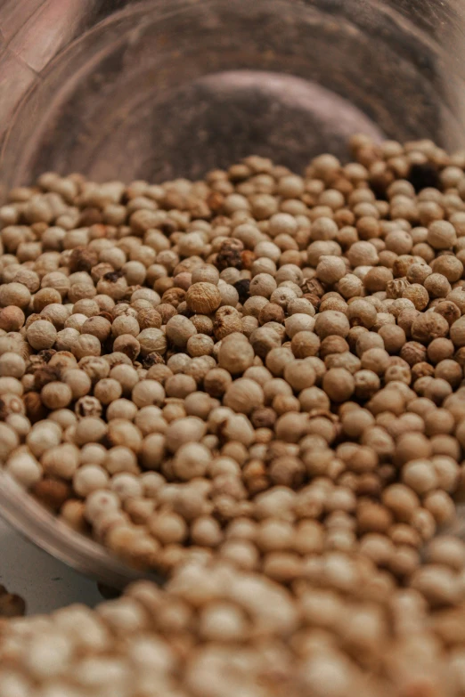 a close up of a bowl of food on a table, pepper, zoomed in, 8l, pearls