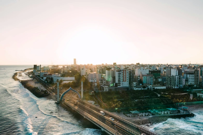 an aerial view of a city next to the ocean, unsplash, hurufiyya, tall bridge with city on top, sunfaded, taiwan, 2 0 0 0's photo