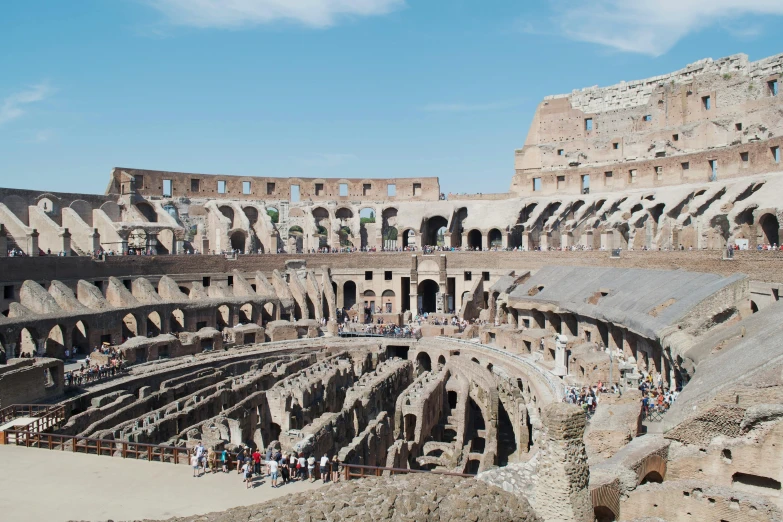 the interior of the colossion in rome, italy, pexels contest winner, 🦩🪐🐞👩🏻🦳, panoramic view, fans, lower and upper levels