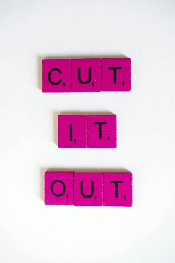 pink blocks spelling out cut it out on a white surface, an album cover, ((purple)), blackout, cutout, without text