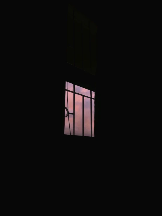 a window in a dark room with a sky in the background, an album cover, inspired by Elsa Bleda, unsplash, pink violet light, natural prison light, dark aesthetic, instagram picture